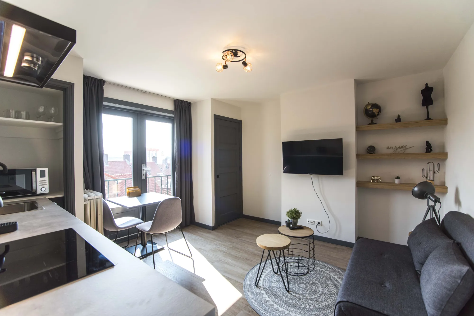 Living room with kitchen and seating area